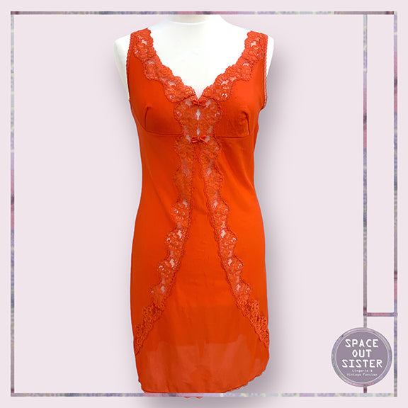 Circa 1960s Vintage Orange Slip with Bows